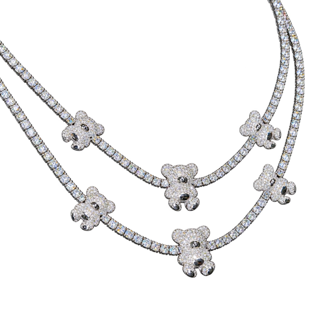 Two tennis chains with stone-set teddy bear charms on a black display — AI-edited studio preview
