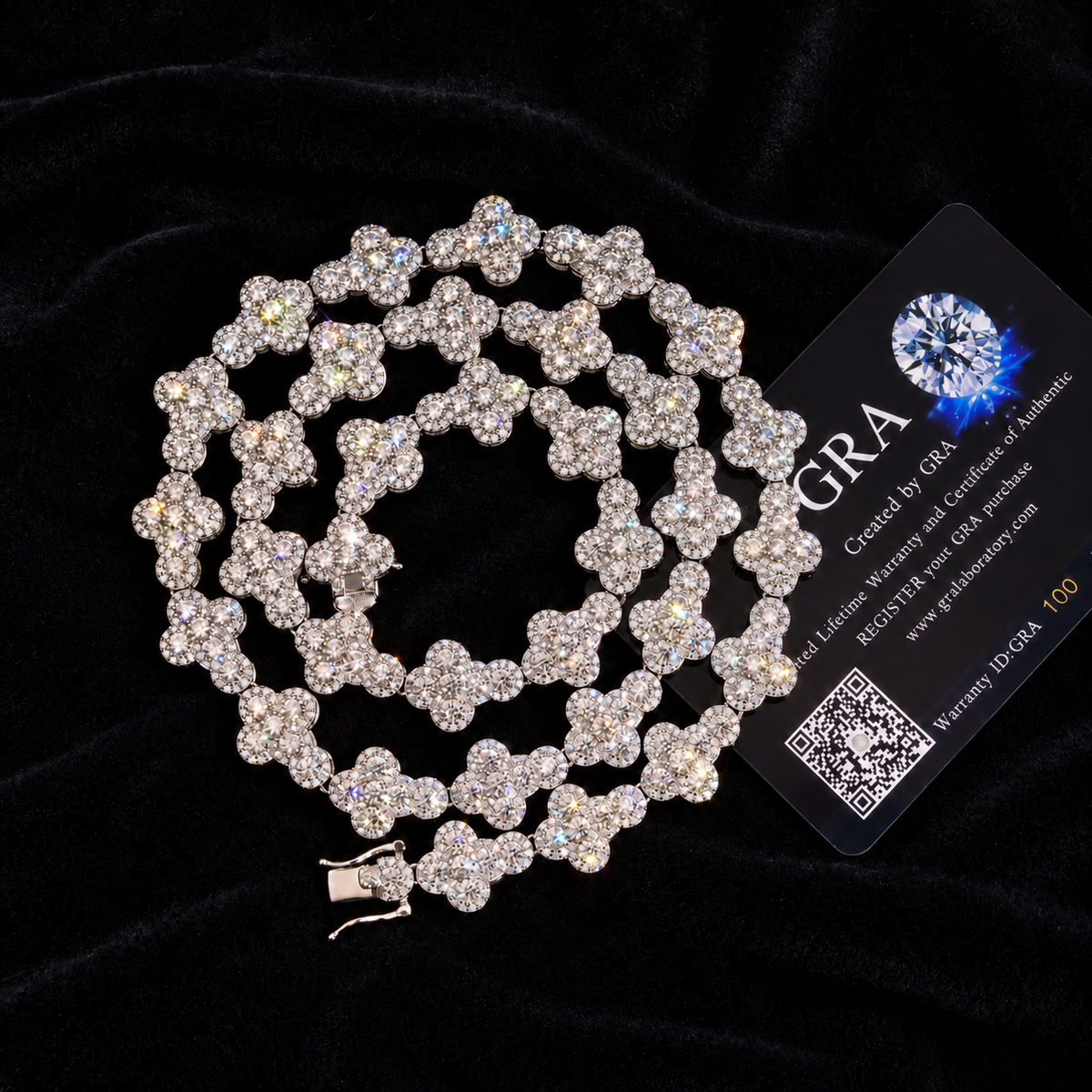 Pavé Clover Link Chain with GRA card in the background