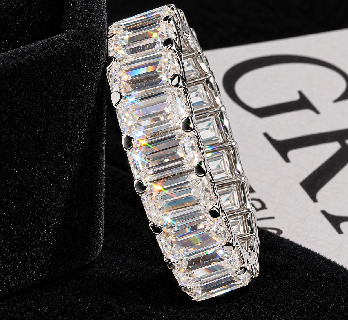Linear-Setting Moissanite Band on a black background, with GRA card visible
