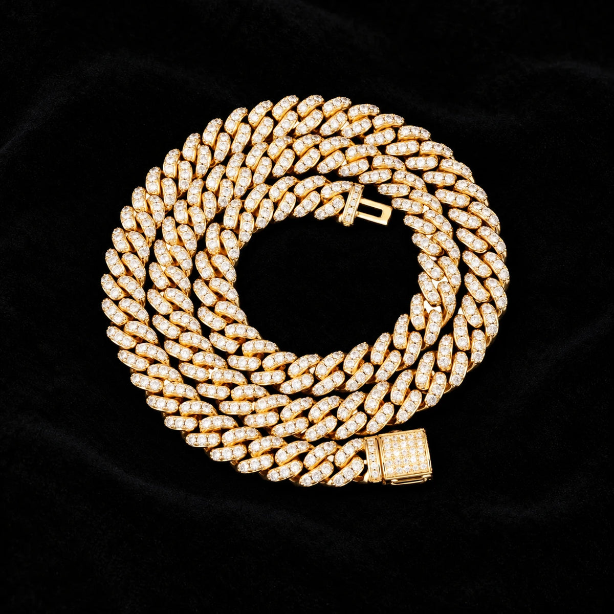 8mm Cuban Chain in yellow gold on black velvet — coiled view