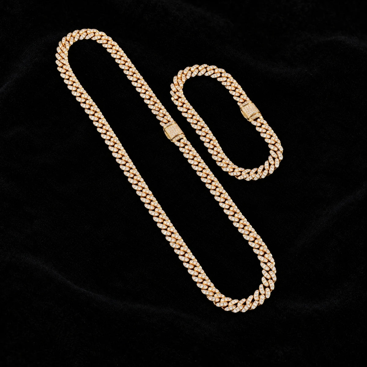 8mm Cuban Chain and matching bracelet in yellow gold on black velvet