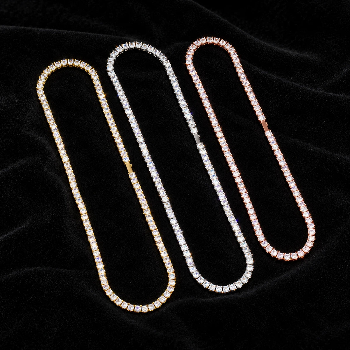 5mm Baguette Tennis Chain on black velvet — yellow gold, white gold and rose gold finishes with moissanite fire