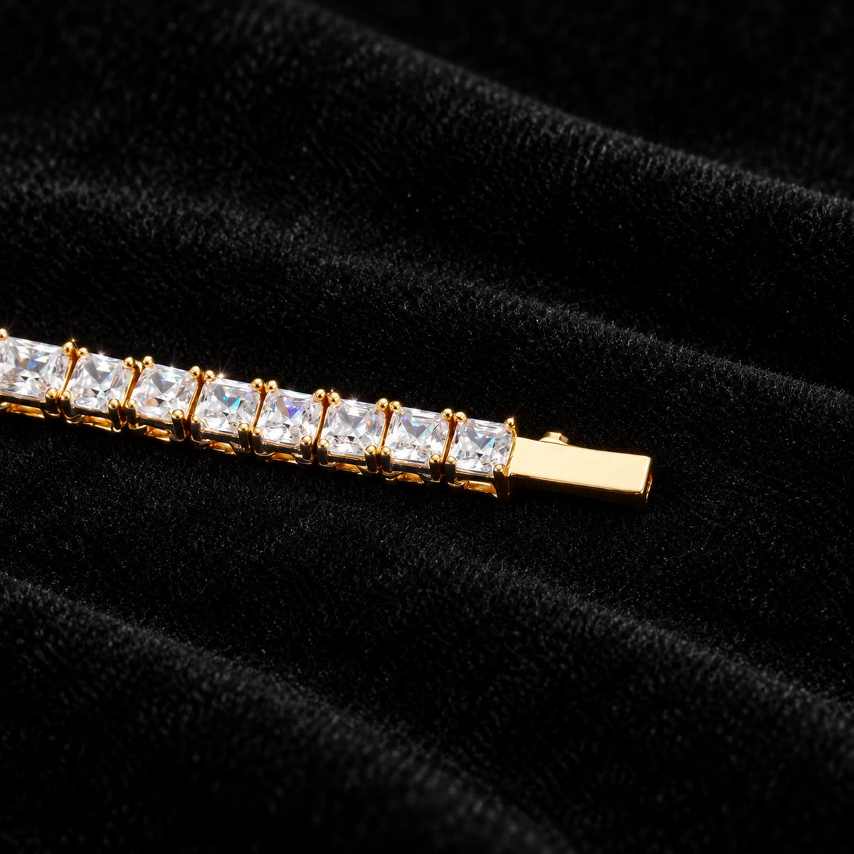 5mm Baguette Tennis Chain on black velvet — yellow gold clasp and stone detail with moissanite fire