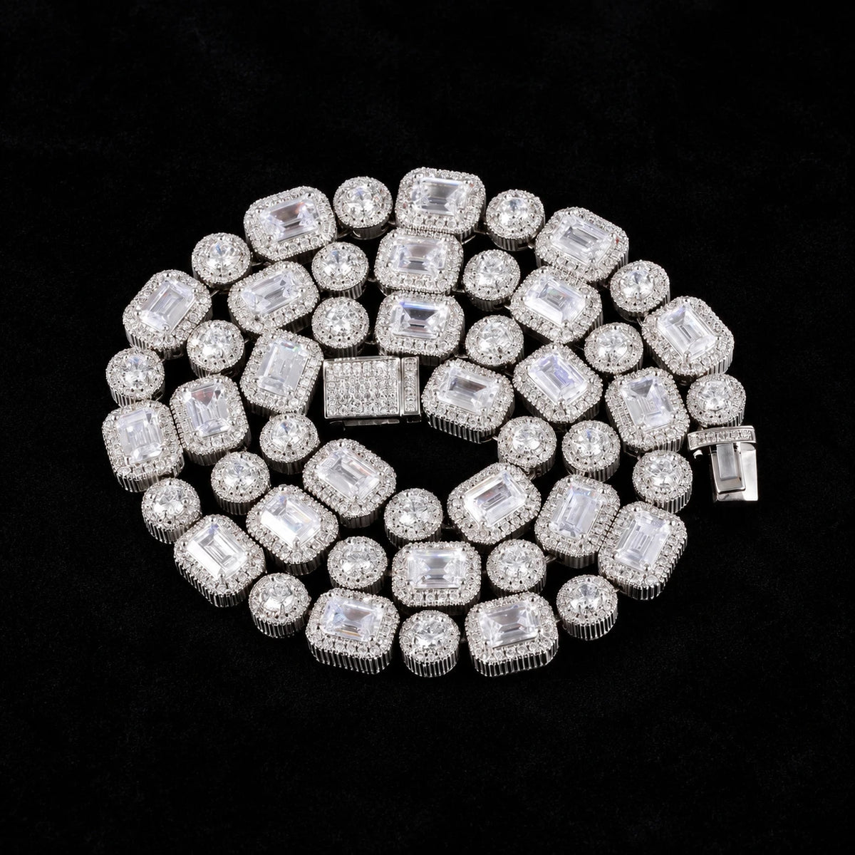 Emerald Clustered Tennis Chain on a black background