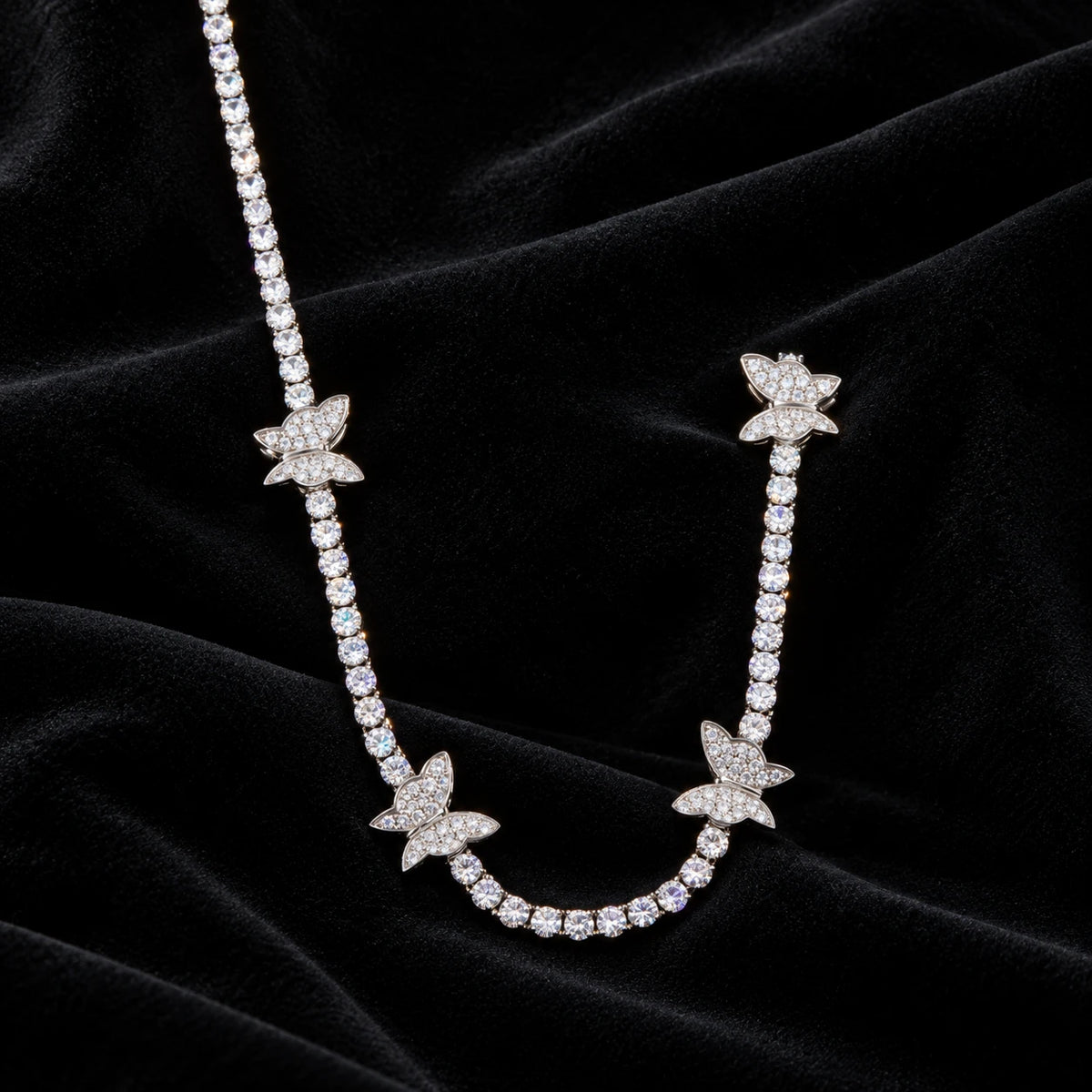 4mm Butterfly Tennis Chain — original finish on black velvet with moissanite fire