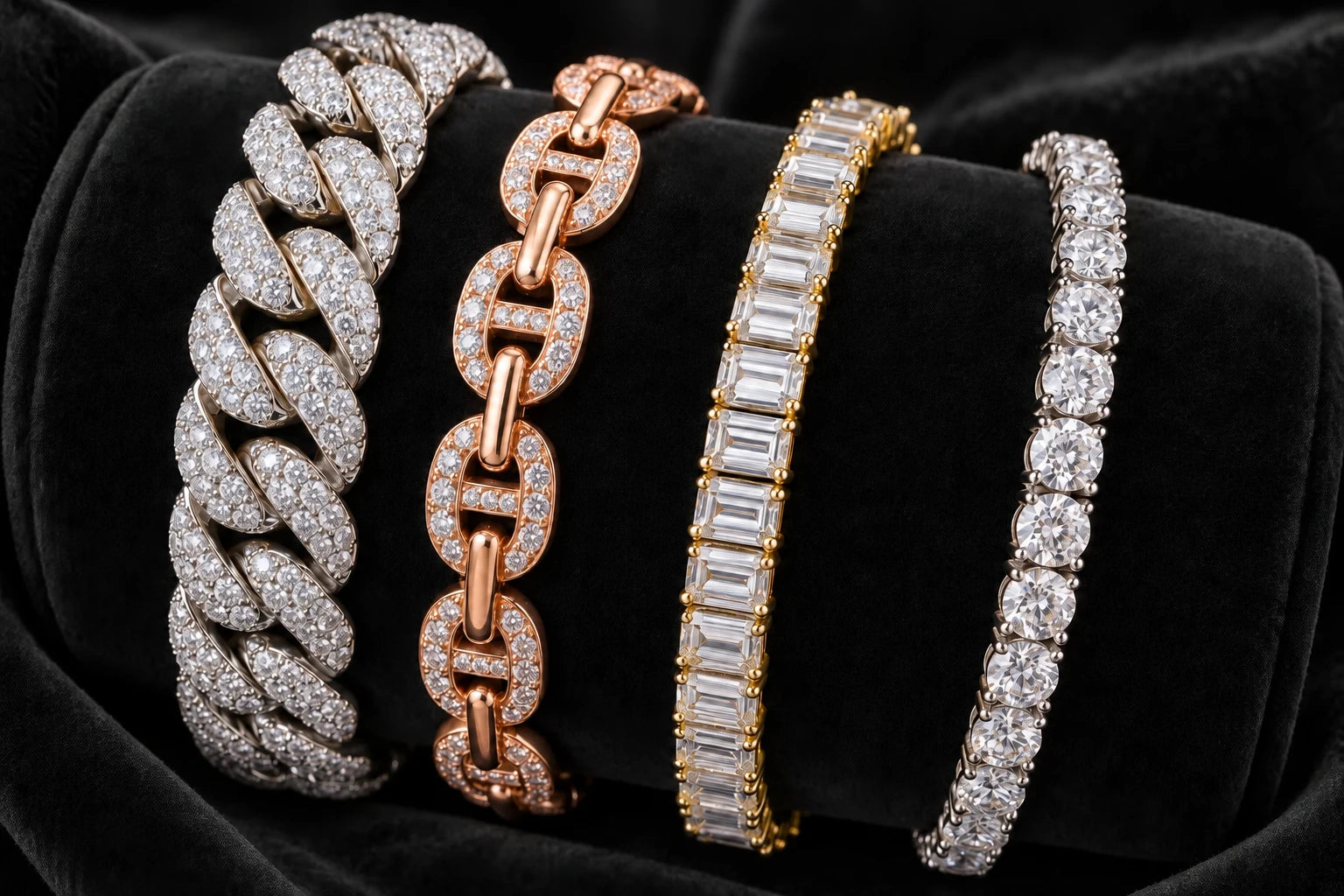 Stone-set bracelets in different link styles on black velvet